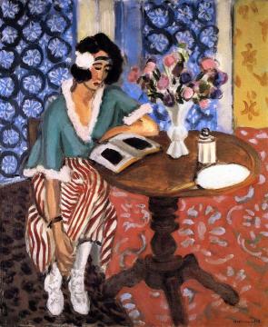 Woman Reading At A Small Table Artwork by Henri Matisse