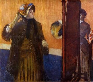 At the Milliner's Artwork by Edgar Degas